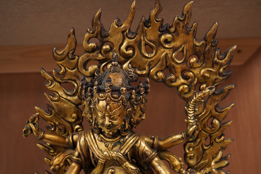 A gilt bronze figure of multi arm Mahakala, 34cm